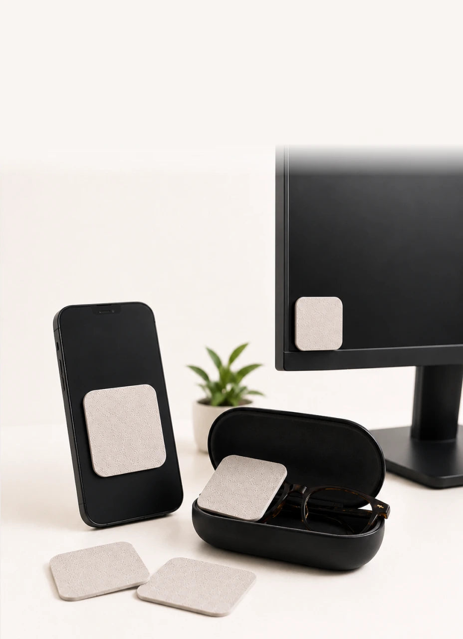 Jiffys pads on a phone, glasses, monitor, and desk